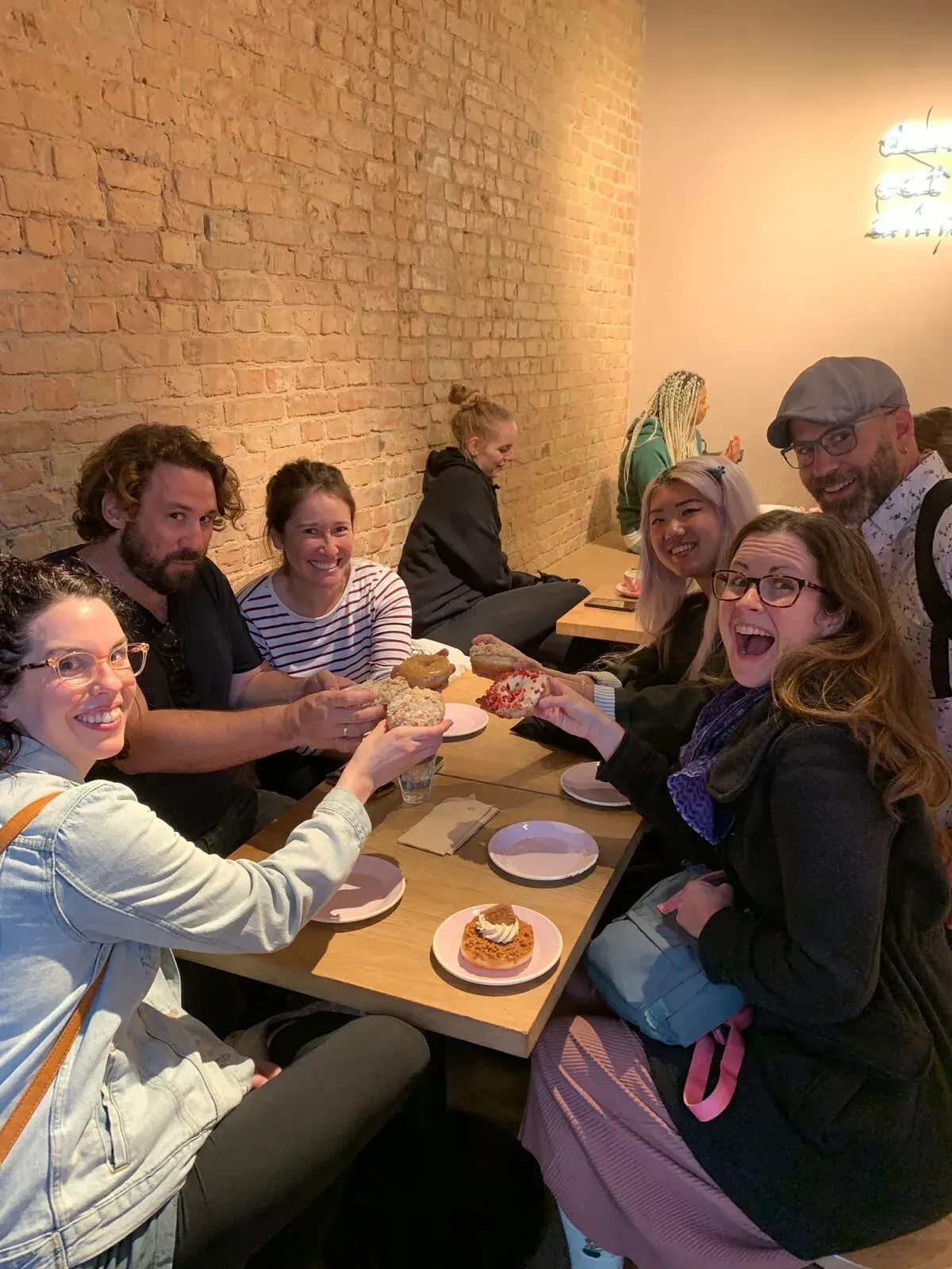 The tour group sharing vegan treats and conversation